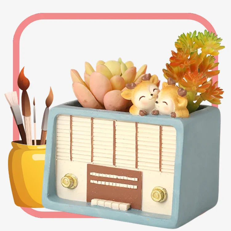 Retro radio-shaped planter with colorful succulents and cute deer figurines on white background