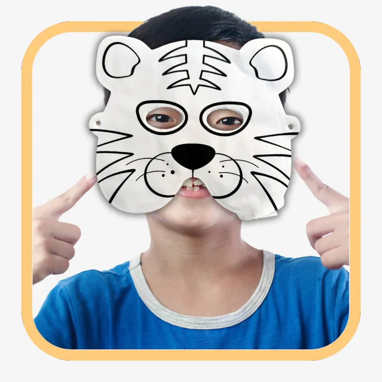 Child wearing a white tiger face mask with black stripes and smiling, pointing fingers at the mask