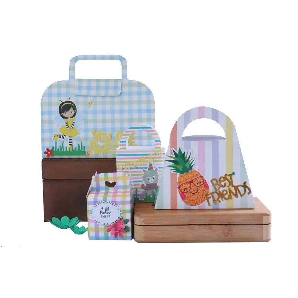 Colorful gift bags with cute cartoon designs including a bee, cat, pineapple, and floral patterns on wooden boxes