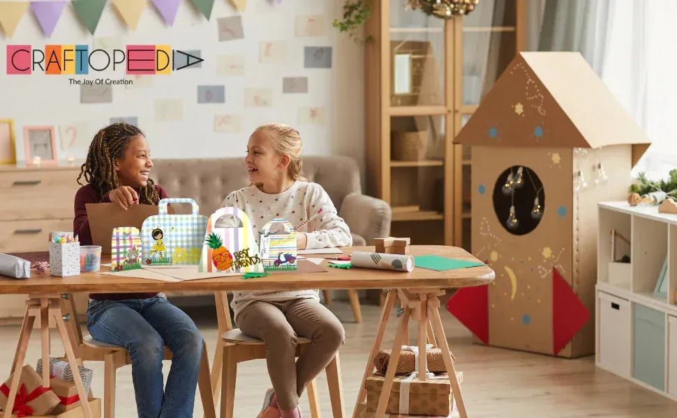 Two children sitting at a table with colorful craft paper bags in a cozy, decorated room with DIY cardboard rocket